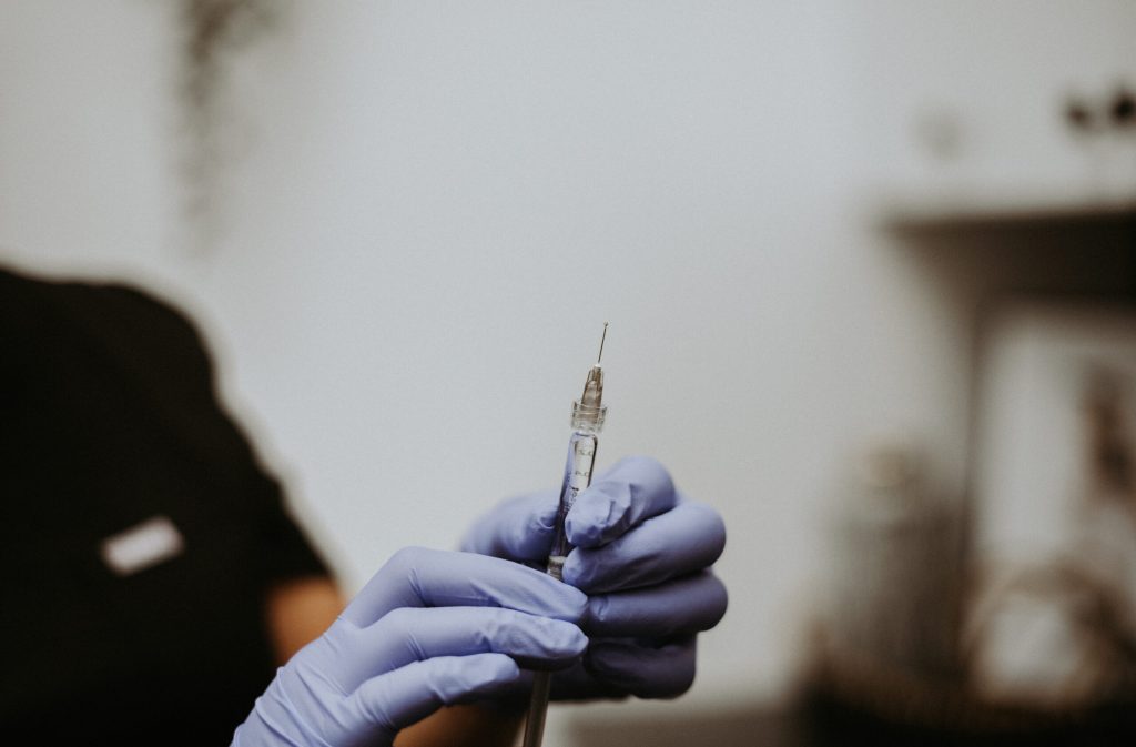 Image of a woman receiving lip filler treatment at TITE Medical Aesthetics