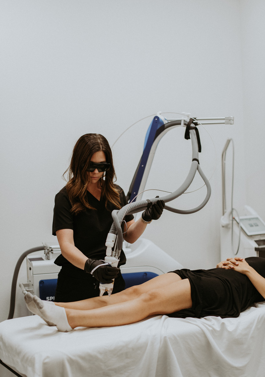 Woman undergoing laser hair removal treatment at TITE Medical Aesthetics